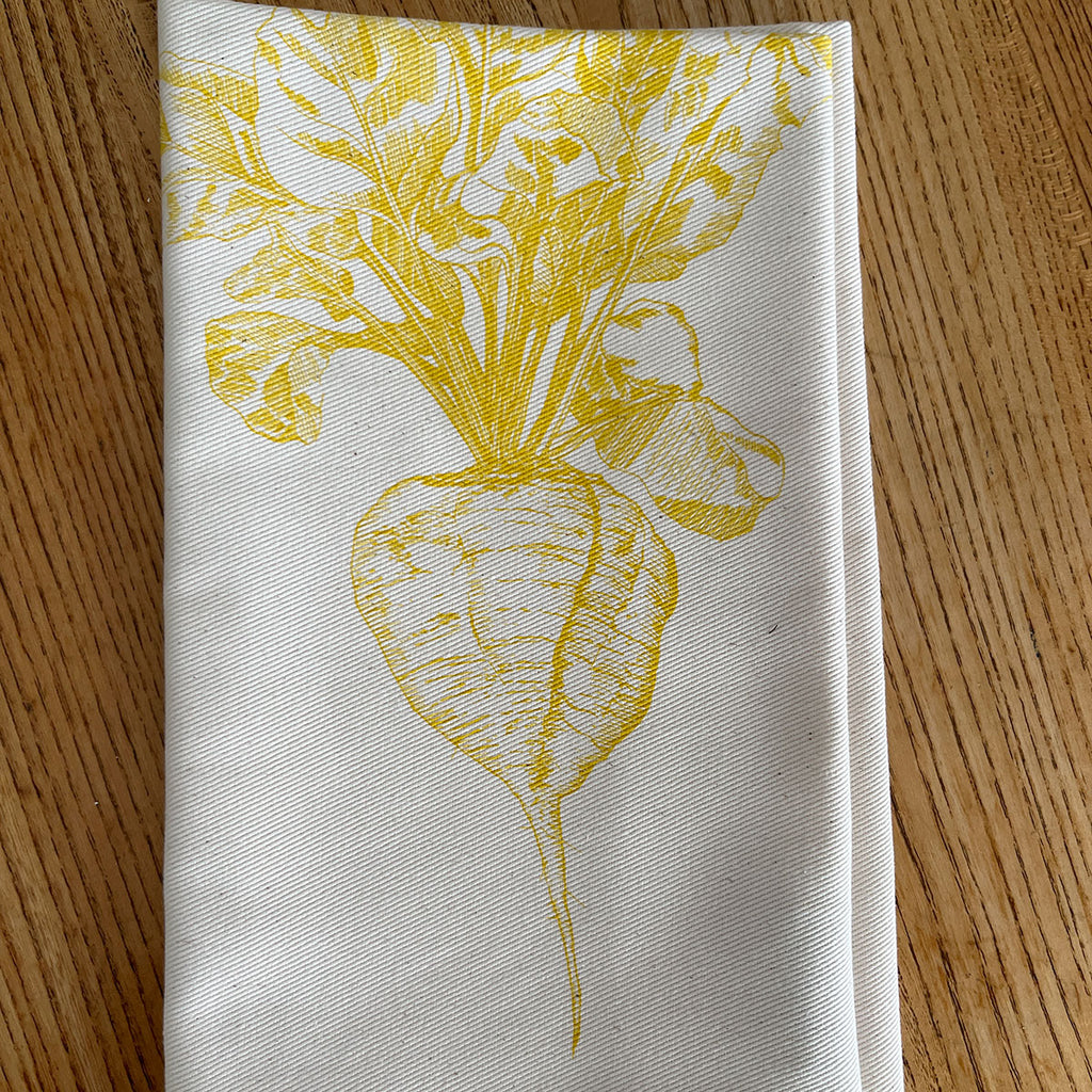 Napkin with yellow sugar beet design created by Lottie Day for Jenny Duff mats