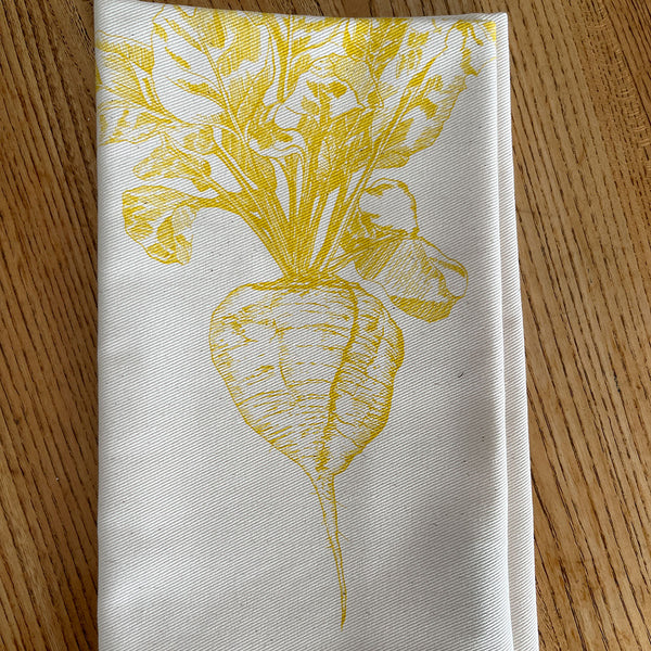 Napkin with yellow sugar beet design created by Lottie Day for Jenny Duff mats