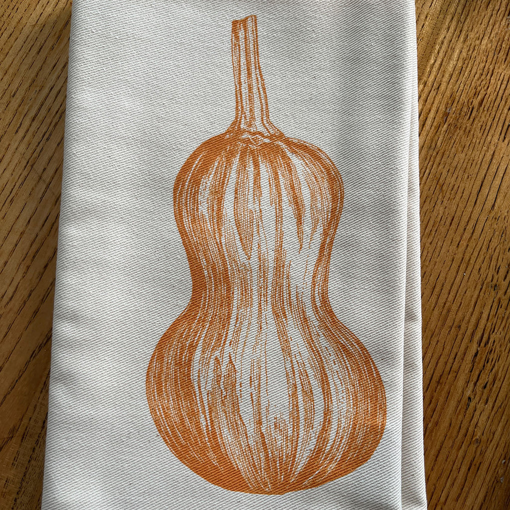 Napkin with a butternut squah design screen printed by Lottie Day for Jenny Duff tableware