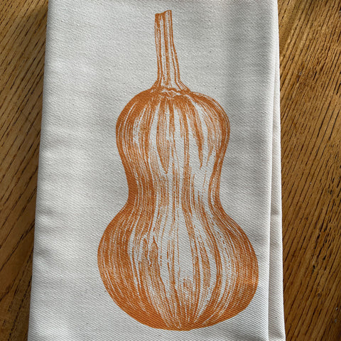 Napkin with a butternut squah design screen printed by Lottie Day for Jenny Duff tableware