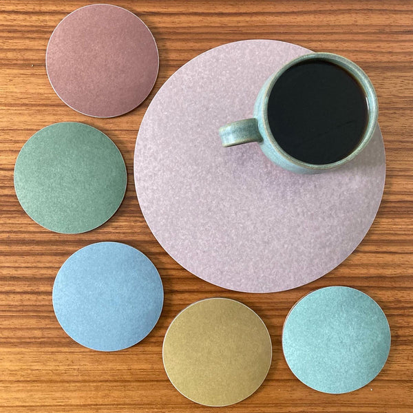 six nature inspired colour coasters with placemat all memamine and made in UK designed by Jenny Duff