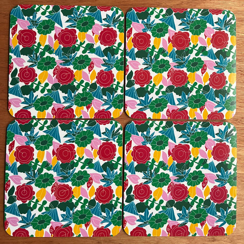set of four placemats with floral design in red pink and green made in the uk and melamine